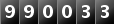 990033