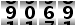 9069