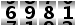 6981