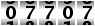 07707